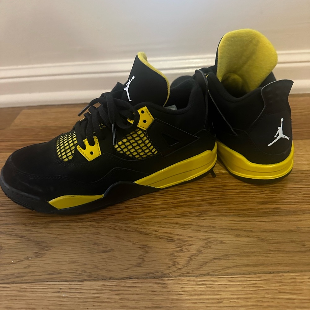 Nike black and yellow Jordan’s